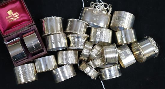 23 silver napkin rings, various, including one cased pair, another pair and a matched set of four, total 17oz approx